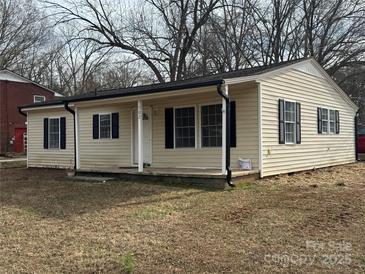 Charming single-story home featuring a covered front porch and classic black shutters at 502 E Maine Ave, Bessemer City, NC 28016