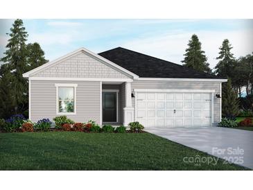 Charming single-story home featuring a two-car garage, manicured lawn and beautiful landscaping at 1422 Windy Park Dr, Stanley, NC 28164