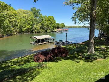 Beautiful lake view featuring a private boat dock and lush green surroundings at 5153 Glenwood St, Sherrills Ford, NC 28673