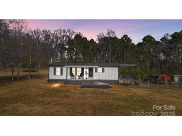 Charming single-story home with a covered porch and freshly painted in a neutral palette at 125 Crescent Heights Dr, Salisbury, NC 28146