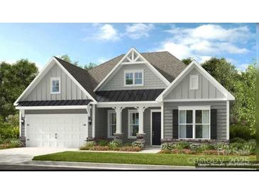 Charming single Gathering home with beautiful landscaping, two-car garage, and neutral color palette at 143 Glenn Dr, Mooresville, NC 28115