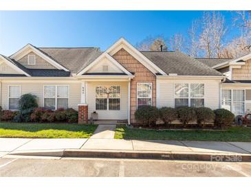 Inviting single-story home featuring manicured landscaping, a cozy front porch, and neutral siding at 605 Gable Dr, Rock Hill, SC 29732