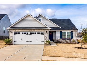 Charming single-Gathering home featuring stone accents, a two-car garage, and a well-manicured lawn at 715 Bonica Ct, Lancaster, SC 29720