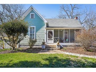 Charming bungalow-style home with a screened-in front porch and mature landscaping at 12 Church St, York, SC 29745