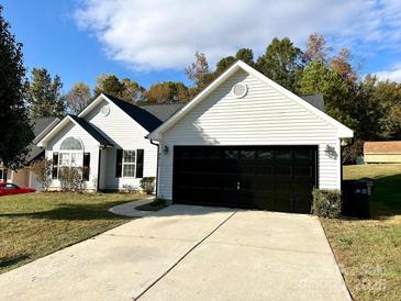 Charming one-story home with a spacious driveway and attached two-car garage at 9513 Isaac Hunter Dr, Charlotte, NC 28214