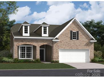 Beautiful, new brick home with a two-car garage and dormer windows provides great curb appeal at 2811 Morning Song Way, Lancaster, SC 29720