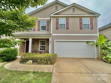 Charming two-story home with a two-car garage, neutral siding, and eye-catching red shutters at 3627 Alexander Forest Dr, Charlotte, NC 28269