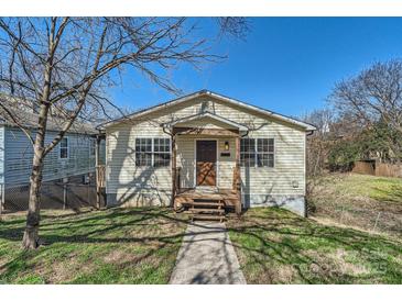 Charming single-story home featuring a covered entryway, siding, and a well-maintained front yard at 1607 Harrill St, Charlotte, NC 28205