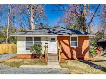 Charming single-story home with brick and siding, featuring a well-manicured lawn and inviting entrance at 2123 Purser Dr, Charlotte, NC 28215