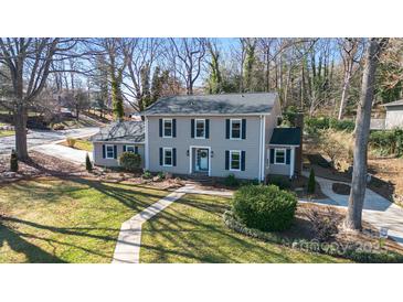 Charming two-story home with a well-manicured front lawn and classic black shutters at 1221 20Th Nw Ave, Hickory, NC 28601