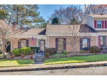 Charming brick townhouse with well-maintained landscaping and an inviting entrance at 7532 Red Oak Ln, Charlotte, NC 28226