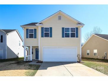 Charming two-story home with blue shutters and a two car garage at 920 Lakehill Rd, Charlotte, NC 28214