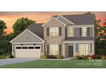 Charming two-story home with brick and siding, complemented by a well-manicured lawn and landscaping at 3523 Rapport Ct # 026, Lancaster, SC 29720