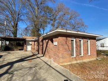 Charming brick home with a carport, a paved driveway, and minimalist landscaping at 1125 Mcdow Dr, Rock Hill, SC 29732