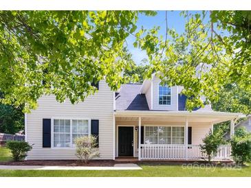Charming two-story home with covered porch, black shutters, and manicured front yard at 1569 Brentfield Dr, Rock Hill, SC 29732