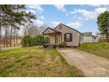 Charming single-story home with a small front porch and a cozy, traditional design at 202 Hovis Rd, Stanley, NC 28164