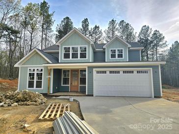Charming two-story home featuring a spacious two-car garage and craftsman-style architecture at 44389 Us 52 N Hwy, Richfield, NC 28137