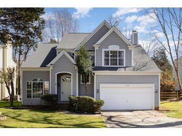Charming two-story home with well-manicured lawn, two car garage, and inviting curb appeal at 7533 Lady Bank Dr, Charlotte, NC 28269