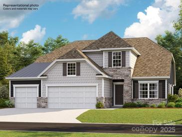 Charming two-story home with stone accents, three-car garage, and well-manicured lawn at 4138 Camden Glen Rd, Lancaster, SC 29720