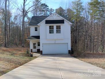 Charming new construction with large driveway and garage, set on wooded lot at 2792 5Th Ne Ave, Hickory, NC 28601