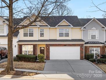 Charming two-story townhouse with a well-manicured lawn and a two car garage at 3465 Caldwell Ridge Pkwy, Charlotte, NC 28213
