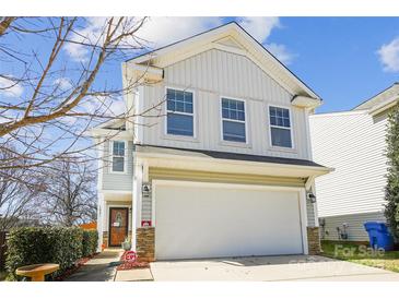 Charming two-story home featuring a garage and manicured landscaping at 1021 Joselynn Dr, Gastonia, NC 28054