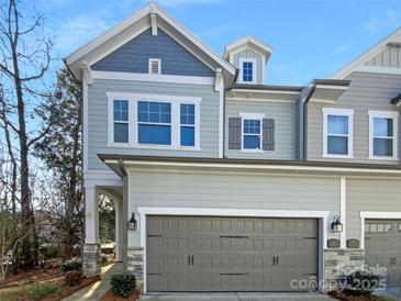 Charming two-story home with attached garage and neutral paint colors at 11005 Cobb Creek Ct, Charlotte, NC 28277