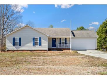 Charming single-story home with blue shutters, front porch, and attached two car garage at 1345 Beagle Run, Salisbury, NC 28146