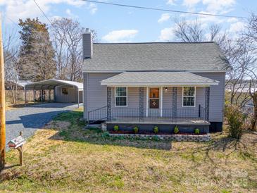 Charming home with gravel driveway and additional building perfect for storage or workspace at 520 Rogers St, Albemarle, NC 28001