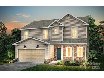 Charming two-story home with stone accents, a two-car garage, and lush landscaping at 5227 Hatcher Creek Rd # 43, Charlotte, NC 28215
