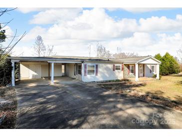 A charming single-story home featuring a covered carport and stone accents at 524 Damascus Church Rd, Statesville, NC 28625
