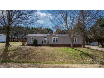 Charming single-story home features a well-maintained yard and inviting entryway at 1841 Ellick Dr, Newton, NC 28658