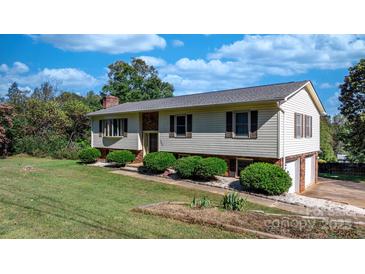 Charming home featuring a well-maintained yard, neutral siding, and mature landscaping at 3808 22Nd Street Ne Ct, Hickory, NC 28601