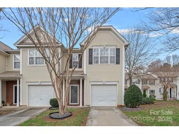 Inviting two-story home featuring a one-car garage and well-maintained landscaping for a charming curb appeal at 4264 Glenlea Commons E Dr, Charlotte, NC 28216
