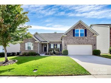 Charming brick home with well-manicured lawn and inviting curb appeal at 7343 Mill Ruins Sw Ave, Concord, NC 28025