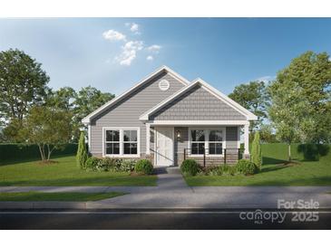 Charming single-Gathering home with gray siding, stone accents, and lush landscaping creates a welcoming curb appeal at Lot 1 4Th St, Statesville, NC 28677