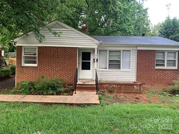 Charming single-story brick home with a well-maintained front yard and inviting entrance at 2508 Druid Hills Way, Charlotte, NC 28206