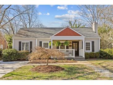 Charming single-Gathering home with a cozy front porch and well-maintained landscaping at 2606 Chesterfield Ave, Charlotte, NC 28205