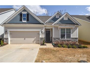 Charming home with blue and beige siding, stone accents, and an attached two-car garage at 4246 Millstream Rd, Denver, NC 28037