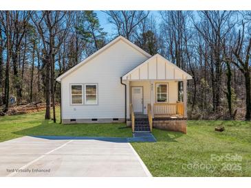 Charming single-story home with fresh landscaping, a welcoming front porch, and a private driveway at 427 Queens Ct, Gastonia, NC 28052