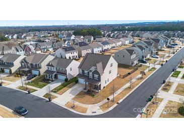 Expansive aerial view of a suburban neighborhood showcasing well-maintained homes and manicured lawns at 14815 Superior St, Charlotte, NC 28273