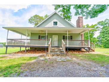 Charming home featuring a covered porch, stone steps and a brick chimney at 3640 Oak Haven Ln, Shelby, NC 28150
