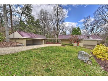 Sprawling single-story home featuring a long driveway, carport and mature trees at 6366 Sharon Hills Rd, Charlotte, NC 28210