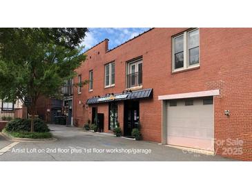 This is the exterior of a red brick commercial building with a mix of office and warehouse spaces at 120 B E Innes St, Salisbury, NC 28144