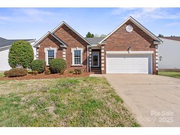 Charming brick home with a two-car garage and well-maintained landscaping at 1207 Overhill Rd, Salisbury, NC 28144