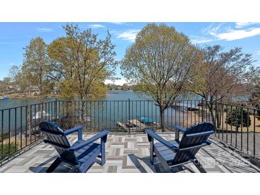 A tranquil balcony view showcases the serene waterfront setting and inviting outdoor space at 17701 Springwinds Dr, Cornelius, NC 28031