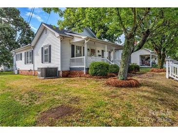 Charming single-Gathering home with a well-maintained lawn and a cozy front porch at 1006 N Ridge Ave, Kannapolis, NC 28083