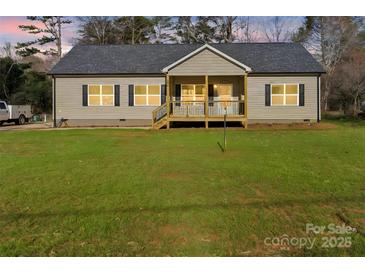Charming single-story home featuring a welcoming front porch and well-maintained lawn at 108 Sarah Ave, Newton, NC 28658