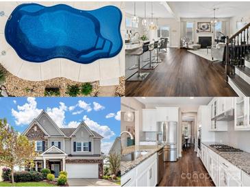 Aerial view of a sparkling in-ground pool with stone landscaping and concrete surround at 2033 Folkstone Ln, Indian Land, SC 29720