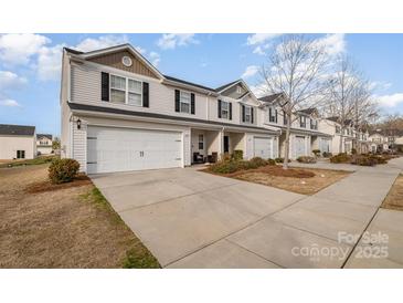 Charming townhome featuring attached garage and inviting curb appeal at 2026 Talbert Ct, Charlotte, NC 28214